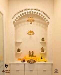 Puja mandir with storage for diyas and incense designed in Calgary home